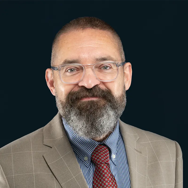 Headshot of Christopher Waugh.