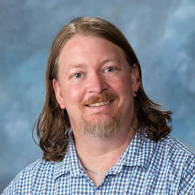 Headshot of John Hagar.